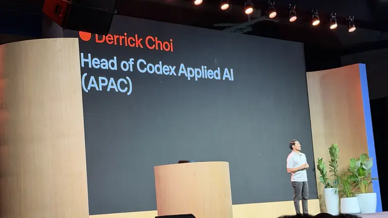 Derrick Choi on stage under a slide naming him Head of Codex Applied AI (APAC)